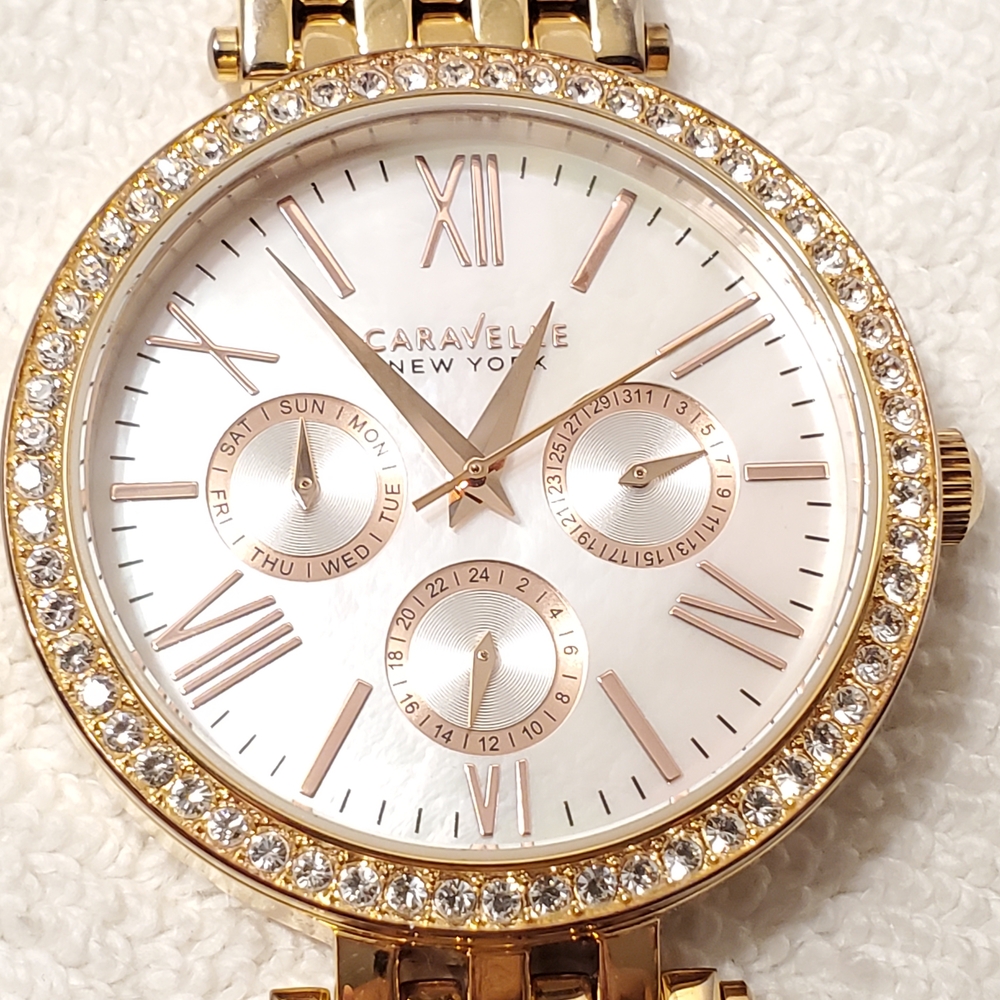 Caravelle New York Women's Gold Tone Watch Crystals Bezel Mother Pearl Dial SS